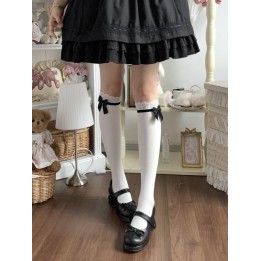 Chaussettes hautes sous le genou à dentelle et nœud satin