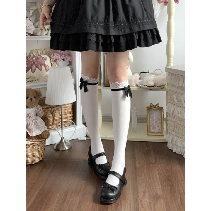 Chaussettes hautes sous le genou à dentelle et nœud satin