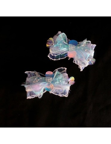 Barrettes à nœud pailleté iridescent avec accents coquillages