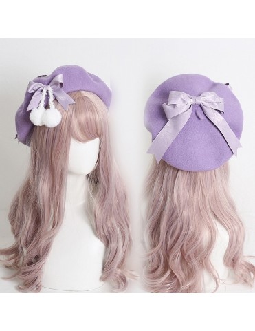 Béret mignon avec nœuds et pompons