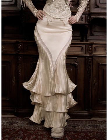 Jupe longue plissée beige clair, coupe sirène à volants